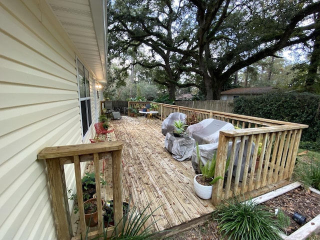 wooden deck featuring fence