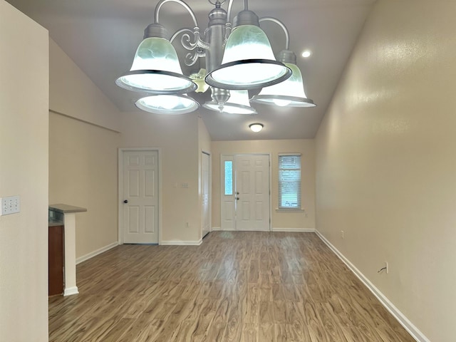 1723 Quazar Rd, Tallahassee, FL 32311 - entryway with wood finished floors, high vaulted ceiling, and a chandelier