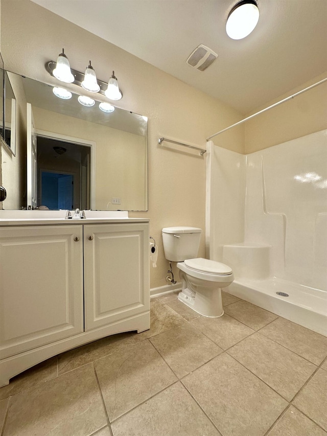 1723 Quazar Rd, Tallahassee, FL 32311 - bathroom featuring a shower, tile patterned floors, and vanity