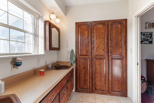 bathroom with tile patterned flooring and vanity