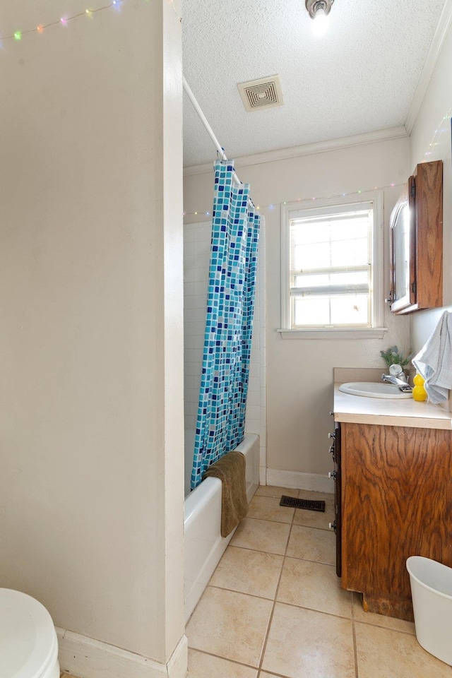 full bath with tile patterned flooring, visible vents, a textured ceiling, and vanity