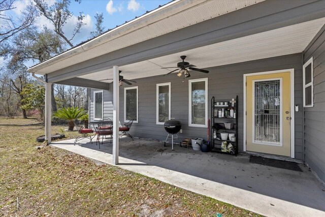 view of patio with a grill and ceiling fan