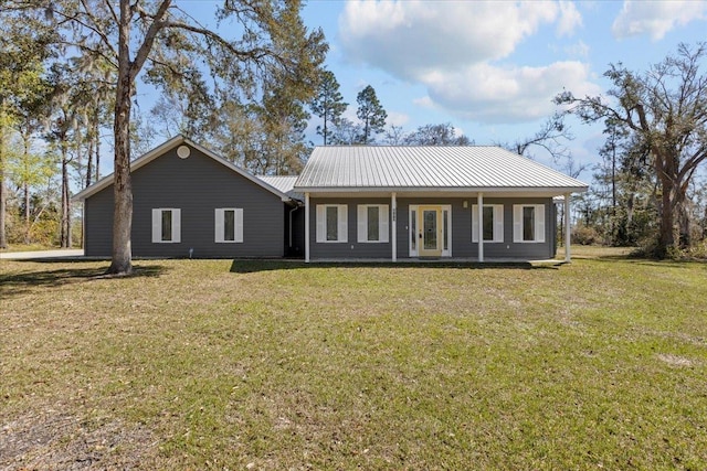 rear view of house featuring a yard, french doors, and metal roof