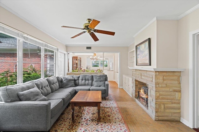 921 Forest Dr, Quincy, FL 32351 - living room featuring a chandelier, ornamental molding, a ceiling fan, brick patterned flooring, and a fireplace