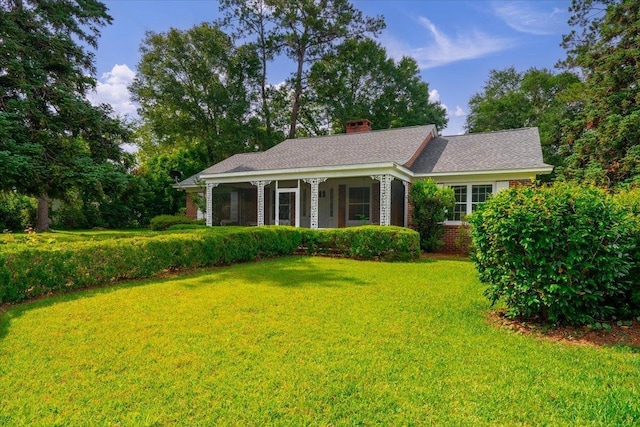 921 Forest Dr, Quincy, FL 32351 - single story home with a front lawn, covered porch, a chimney, and brick siding
