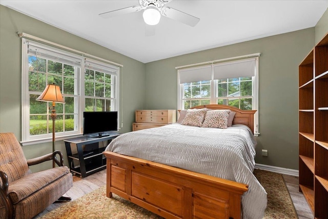 921 Forest Dr, Quincy, FL 32351 - bedroom featuring multiple windows, light wood-style floors, and ceiling fan