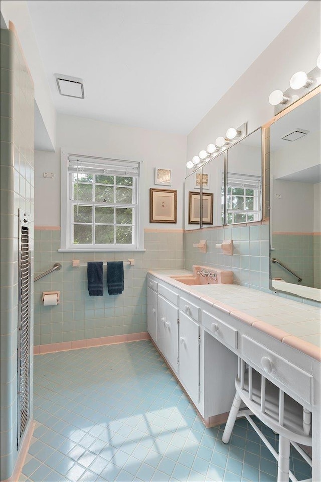 921 Forest Dr, Quincy, FL 32351 - full bath with tile walls, vanity, tile patterned flooring, and a wainscoted wall