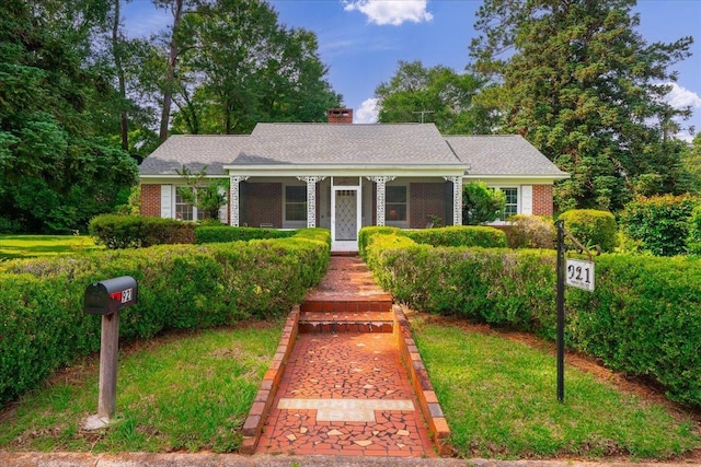 921 Forest Dr, Quincy, FL 32351 - view of front of property featuring brick siding, a chimney, and covered porch