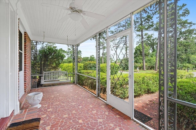 921 Forest Dr, Quincy, FL 32351 - unfurnished sunroom featuring ceiling fan, healthy amount of natural light, and view of scattered trees
