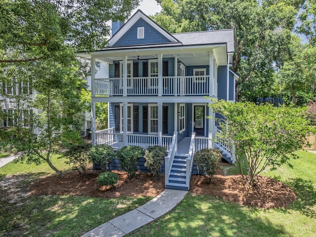 2424 Old Saint Augustine Rd, Tallahassee, FL 32301 - view of front of house featuring a balcony, a porch, a front lawn, stairway, and roof with shingles