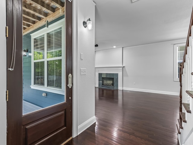 2424 Old Saint Augustine Rd, Tallahassee, FL 32301 - doorway to outside with stairway, dark wood finished floors, and a fireplace