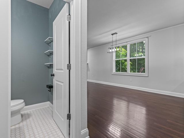 2424 Old Saint Augustine Rd, Tallahassee, FL 32301 - bathroom with toilet and wood finished floors