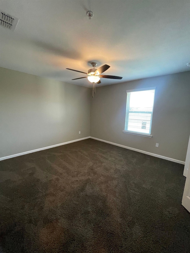 2281 Del Carmel Way, Tallahassee, FL 32303 - unfurnished room featuring dark carpet, a ceiling fan, and fire sprinkler in ceiling