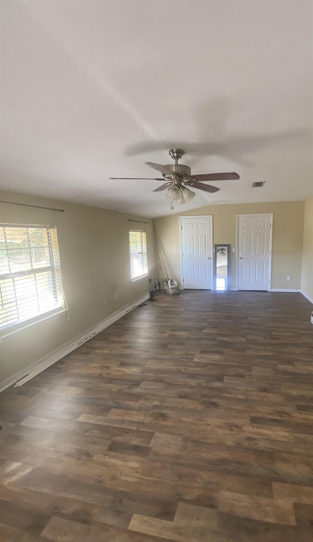 unfurnished room featuring dark hardwood / wood-style floors and ceiling fan