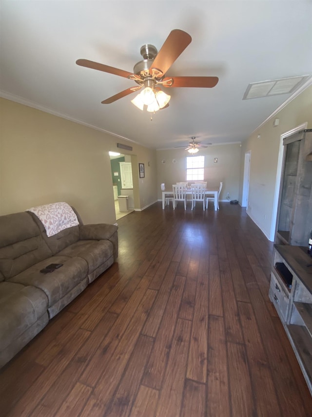 unfurnished living room featuring crown molding and dark hardwood / wood-style flooring