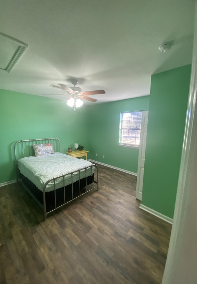 bedroom featuring ceiling fan and dark hardwood / wood-style flooring