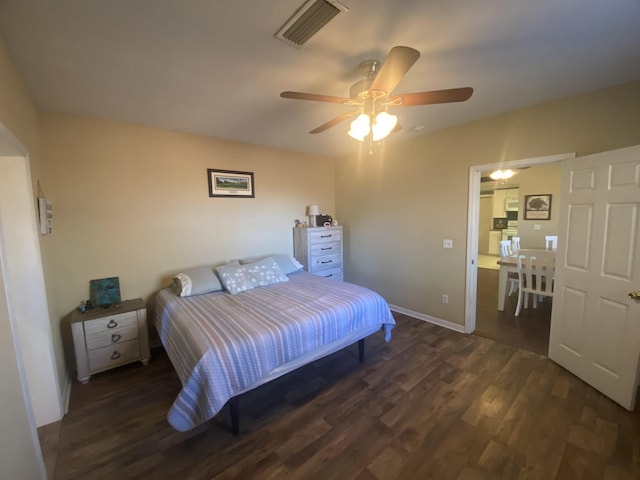 bedroom featuring dark wood-type flooring and ceiling fan