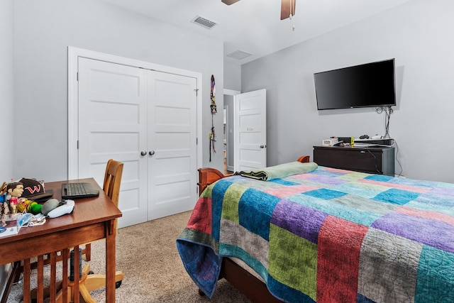 carpeted bedroom with a closet and ceiling fan