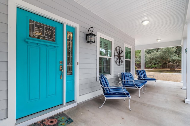 property entrance featuring a porch