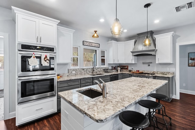 kitchen featuring appliances with stainless steel finishes and white cabinets