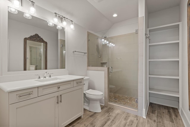 4318 Terebinth Trl, Tallahassee, FL 32317 - full bath featuring toilet, vanity, a shower stall, wood finished floors, and recessed lighting