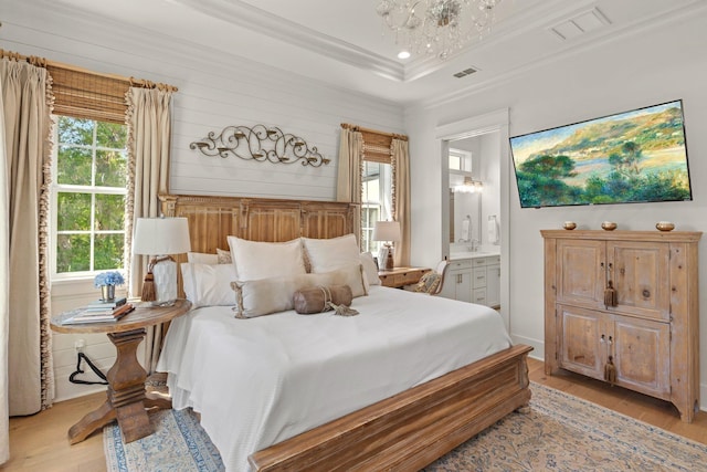 4318 Terebinth Trl, Tallahassee, FL 32317 - bedroom featuring light wood-style floors, ornamental molding, a chandelier, ensuite bath, and recessed lighting