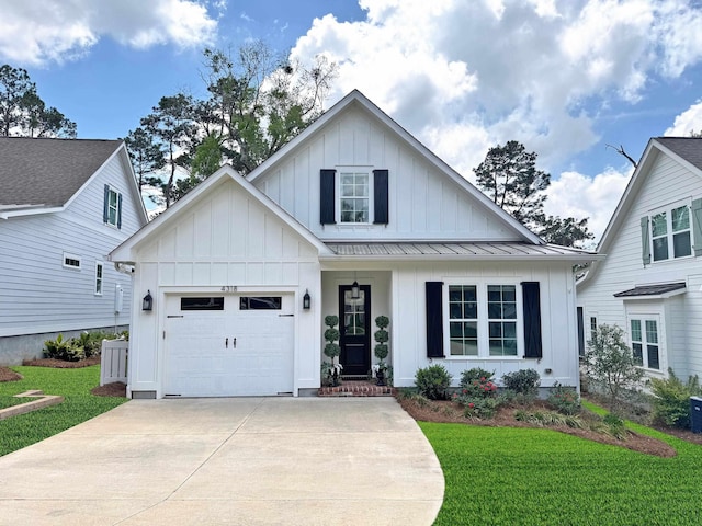 4318 Terebinth Trl, Tallahassee, FL 32317 - modern farmhouse style home featuring board and batten siding, an attached garage, driveway, a front lawn, and a standing seam roof