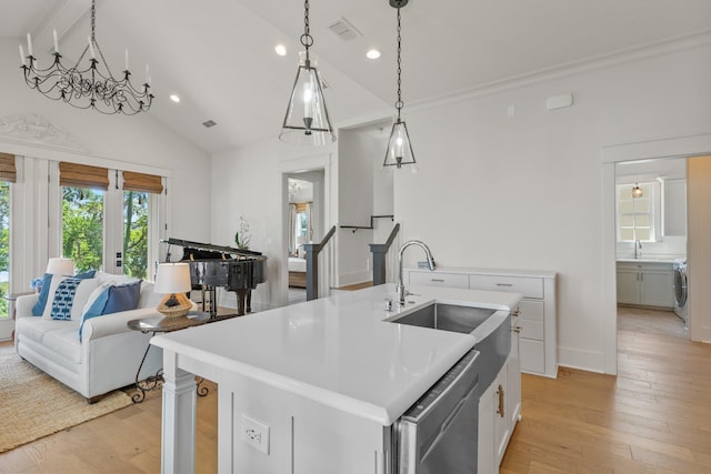 4318 Terebinth Trl, Tallahassee, FL 32317 - kitchen featuring washer / clothes dryer, stainless steel dishwasher, recessed lighting, light wood-type flooring, and a sink