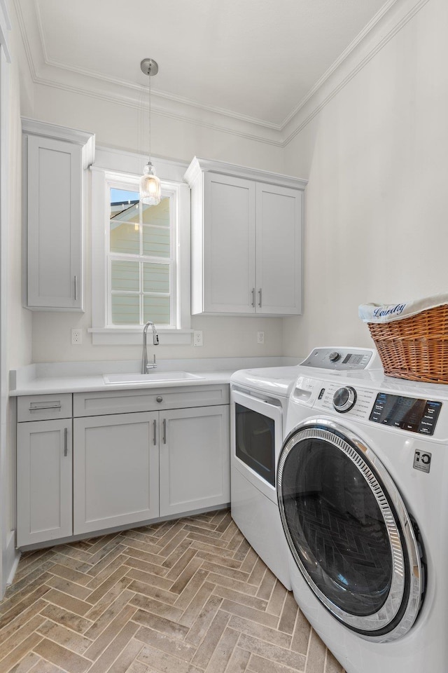 4318 Terebinth Trl, Tallahassee, FL 32317 - washroom featuring washing machine and dryer, cabinet space, crown molding, and brick patterned floors