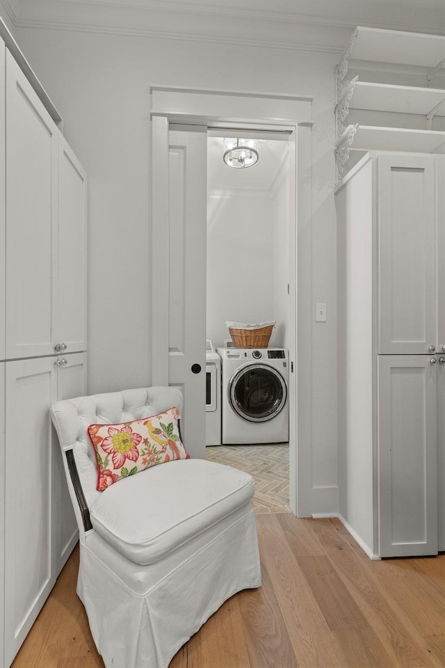 4318 Terebinth Trl, Tallahassee, FL 32317 - washroom with ornamental molding, light wood-style floors, washing machine and clothes dryer, and baseboards