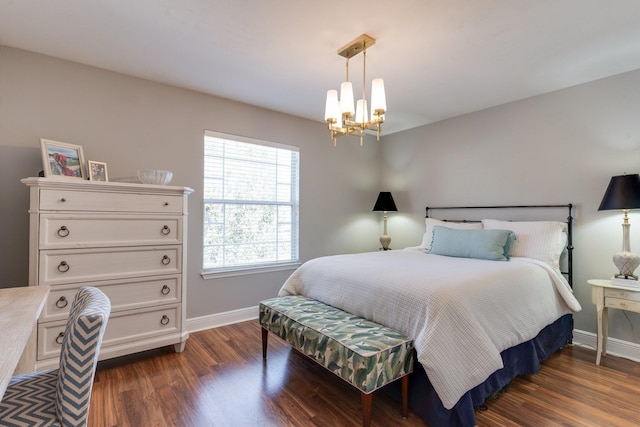 bedroom featuring a chandelier and dark hardwood / wood-style flooring