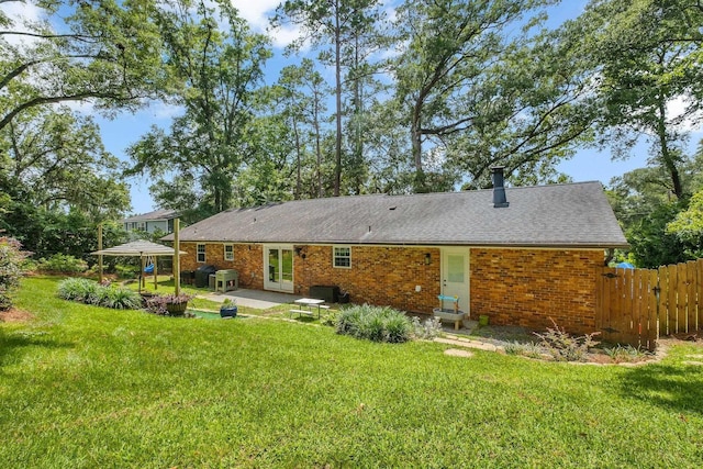 2809 Trebark Dr, Tallahassee, FL 32312 - rear view of property featuring a patio area, brick siding, a gazebo, and roof with shingles
