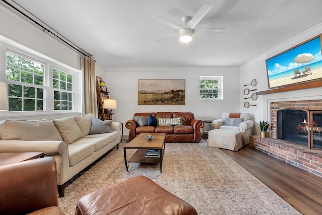 2809 Trebark Dr, Tallahassee, FL 32312 - living room with wood finished floors, ceiling fan, and a brick fireplace