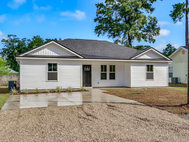 ranch-style home with central AC unit and a patio