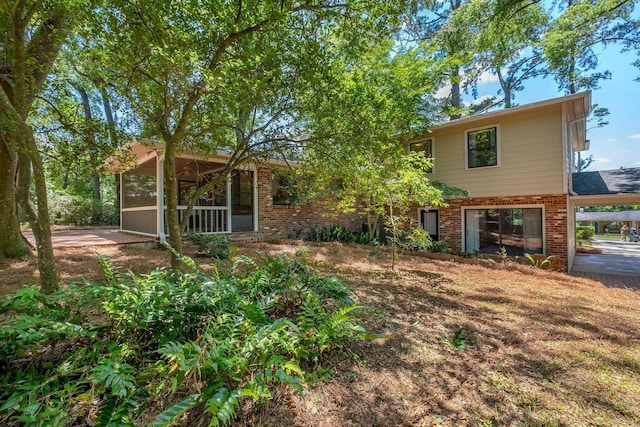 2003 Chuli Nene, Tallahassee, FL 32301 - view of front of house with brick siding and a sunroom