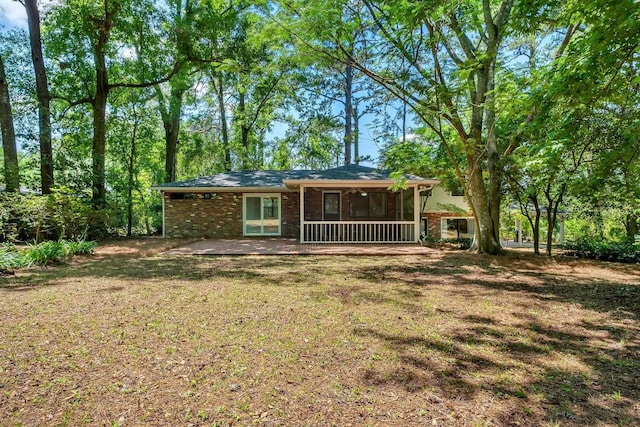 2003 Chuli Nene, Tallahassee, FL 32301 - back of property with brick siding and a lawn