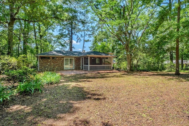 2003 Chuli Nene, Tallahassee, FL 32301 - rear view of house featuring a sunroom and brick siding