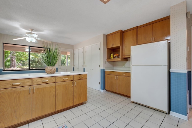 2003 Chuli Nene, Tallahassee, FL 32301 - kitchen with freestanding refrigerator, light countertops, wallpapered walls, a ceiling fan, and open shelves