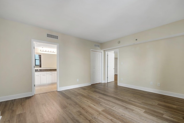 300 S Duval St Unit 612, Tallahassee, FL 32301 - spare room featuring light wood-type flooring and baseboards
