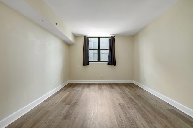 300 S Duval St Unit 612, Tallahassee, FL 32301 - spare room featuring wood finished floors and baseboards