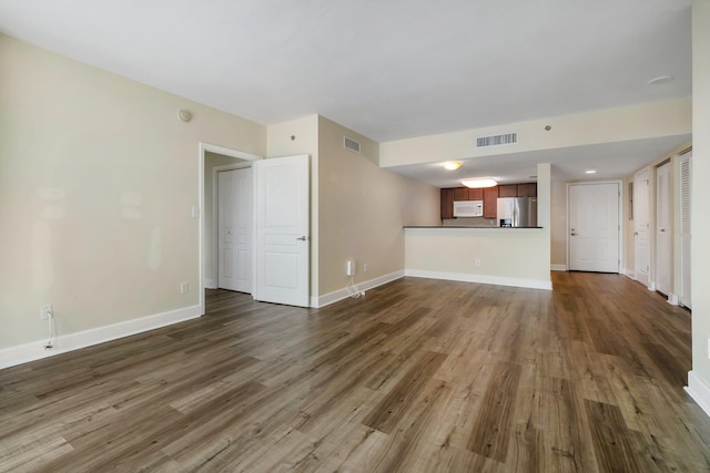 300 S Duval St Unit 612, Tallahassee, FL 32301 - unfurnished living room with dark wood finished floors