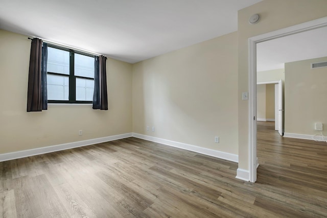 300 S Duval St Unit 612, Tallahassee, FL 32301 - empty room featuring wood finished floors and a smoke detector