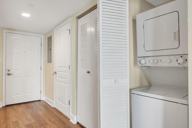 300 S Duval St Unit 612, Tallahassee, FL 32301 - washroom featuring estacked washer and dryer, light wood finished floors, electric panel, and recessed lighting