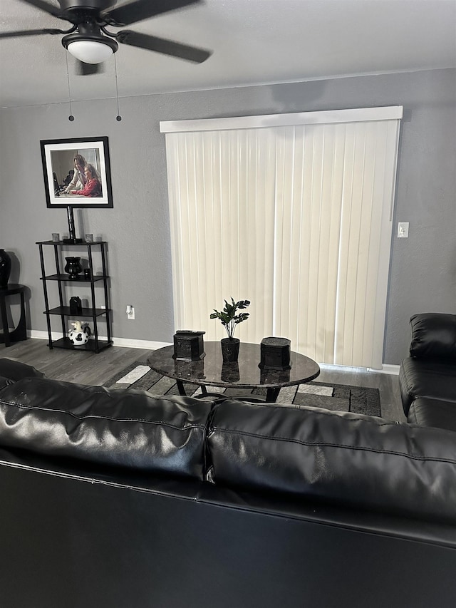 1216 Hidden Pl, Tallahassee, FL 32304 - living room with wood finished floors, a ceiling fan, and baseboards