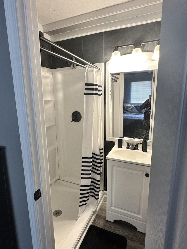 1216 Hidden Pl, Tallahassee, FL 32304 - full bathroom with a shower stall, vanity, and wood finished floors
