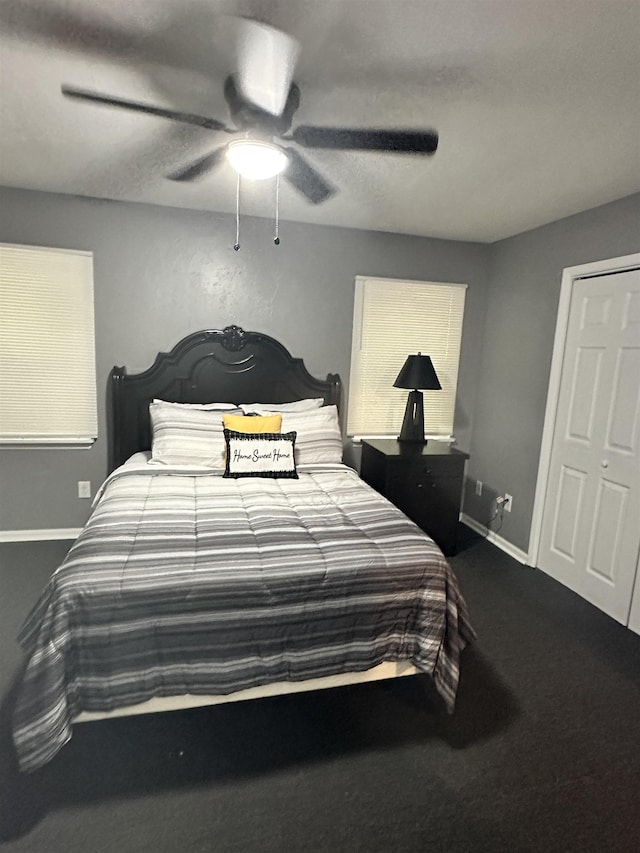 1216 Hidden Pl, Tallahassee, FL 32304 - bedroom with baseboards, ceiling fan, and dark carpet