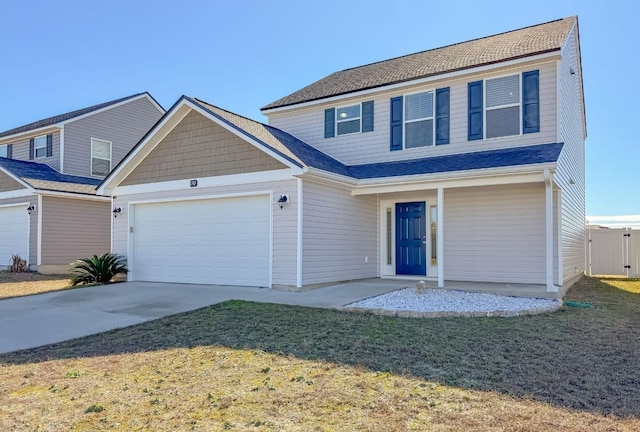 view of front of home with a garage and a front yard