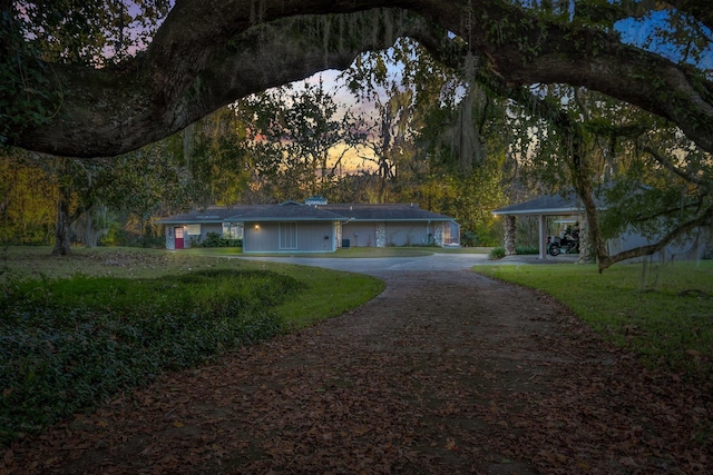 ranch-style home featuring a yard