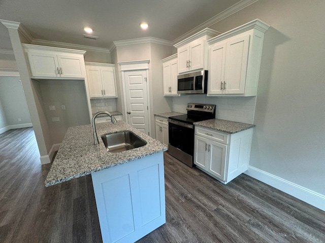 kitchen with white cabinetry, sink, a kitchen island with sink, and appliances with stainless steel finishes