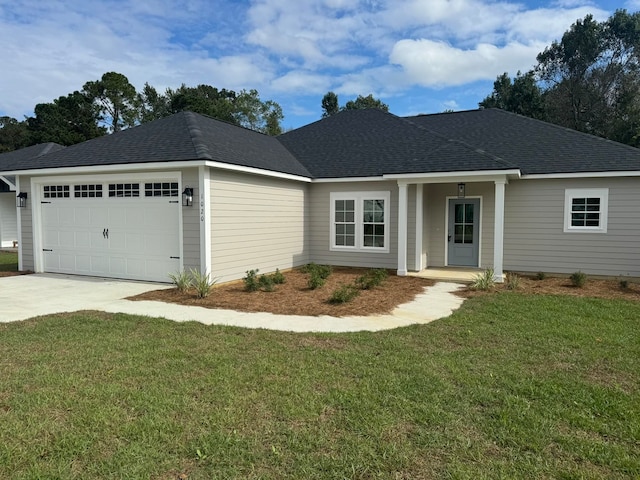 ranch-style house with a garage and a front yard